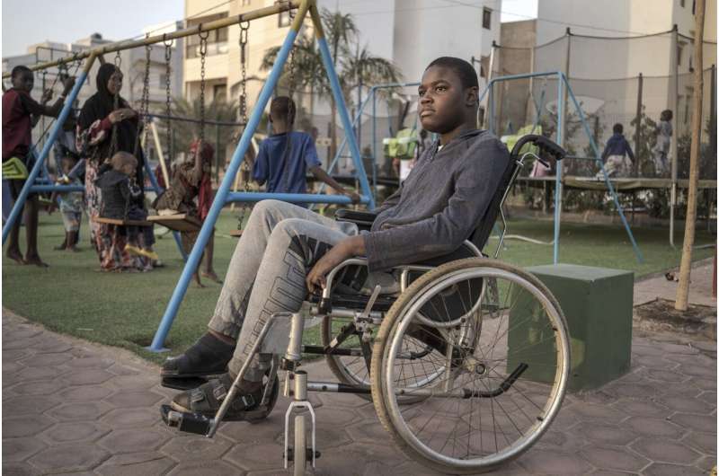 Mamadou, 13, watches children play in Dakar, Senegal, Saturday January 11, 2025. Credit: AP Photo/Annika Hammerschlag Rare diseases often go undiagnosed or untreated in parts of Africa. A project seeks to change that